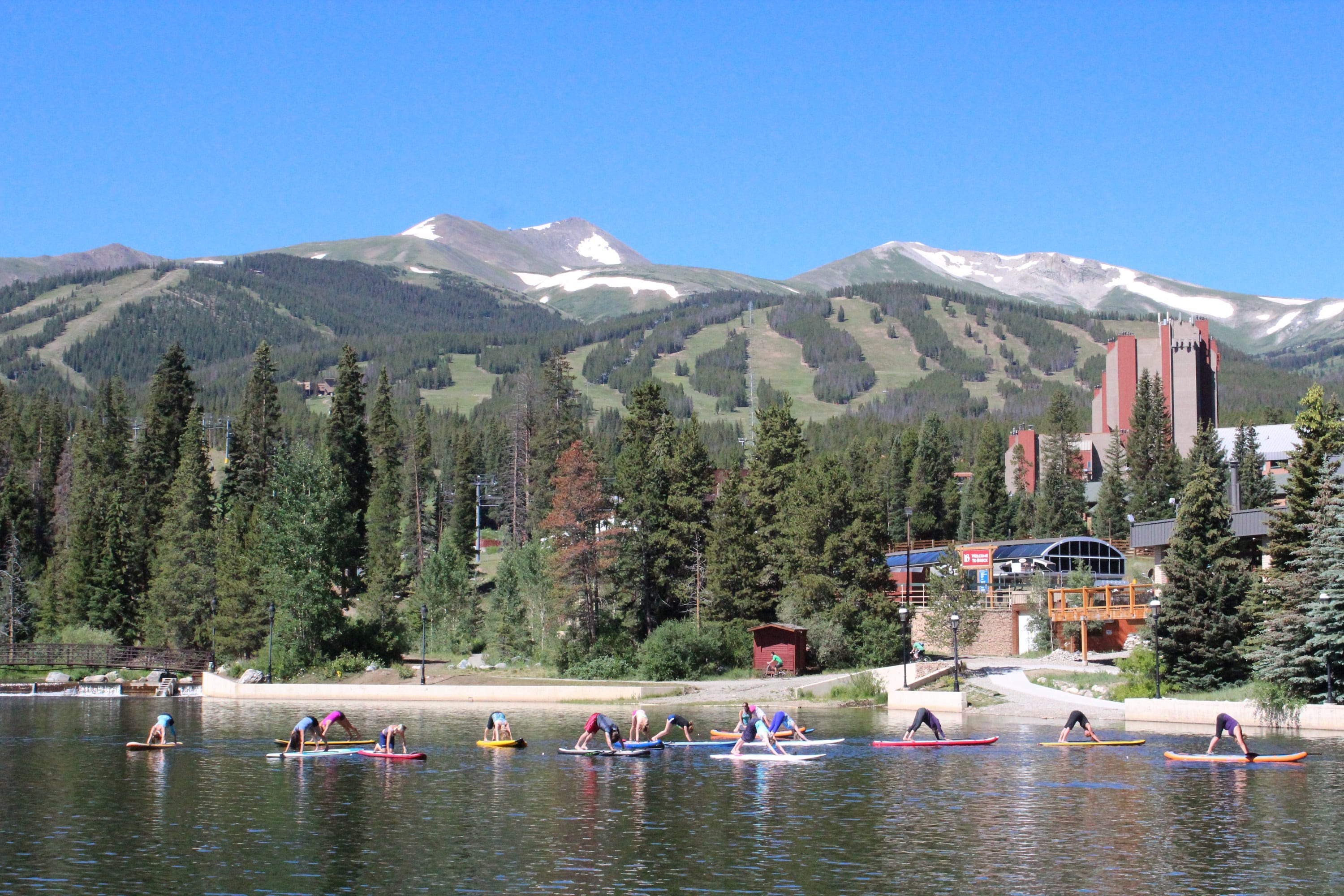 Yoga class practices yoga on a paddleboard in Breckenridge, CO