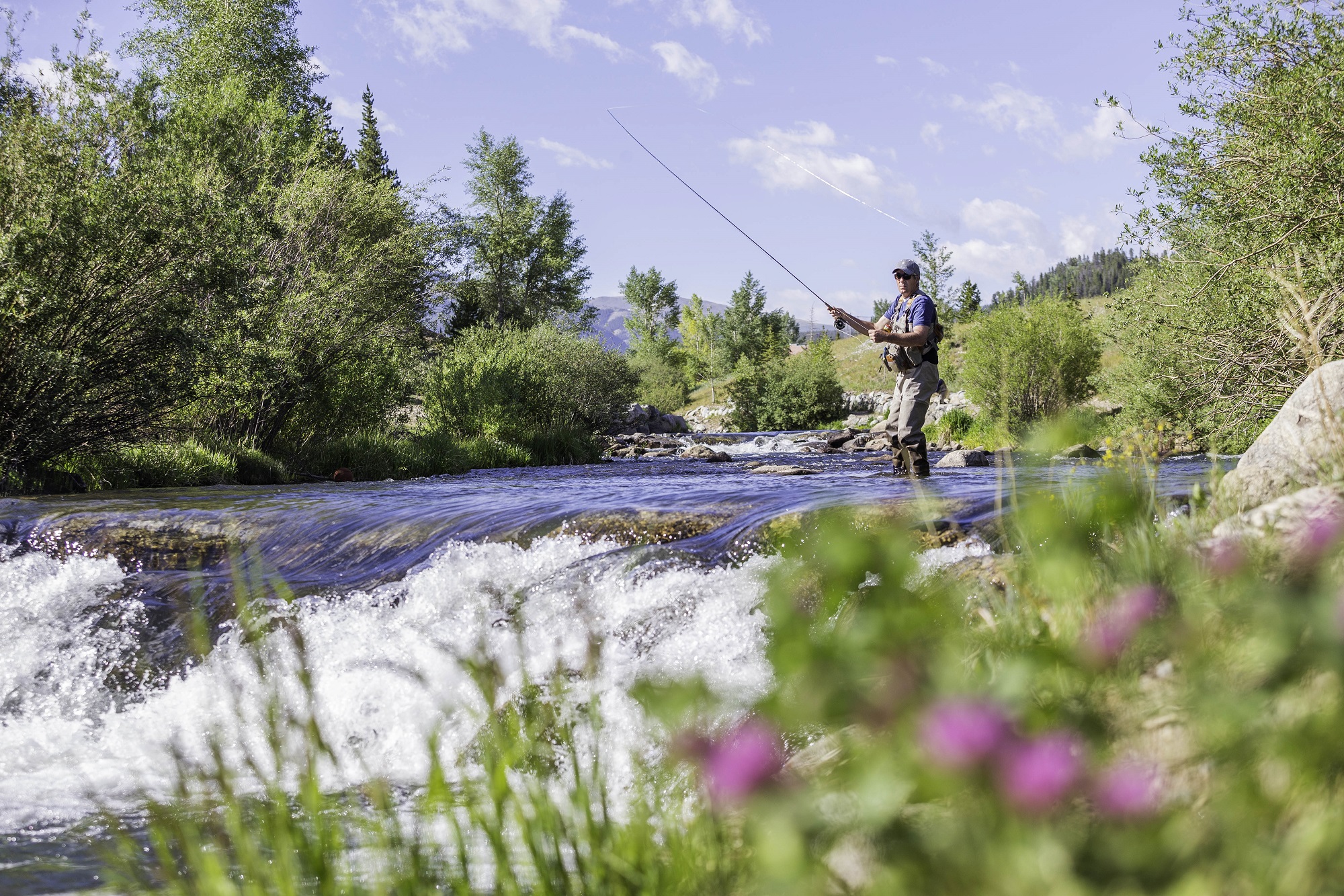 Man fly fishing in the river at Breckenridge