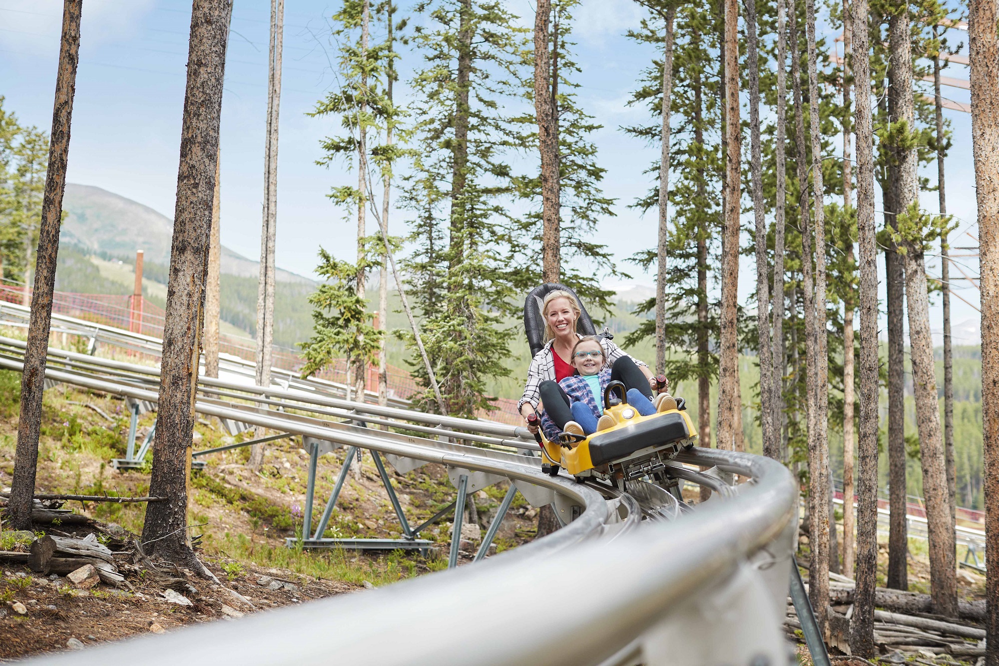 A mom and child on the Alpine Coaster at Breck