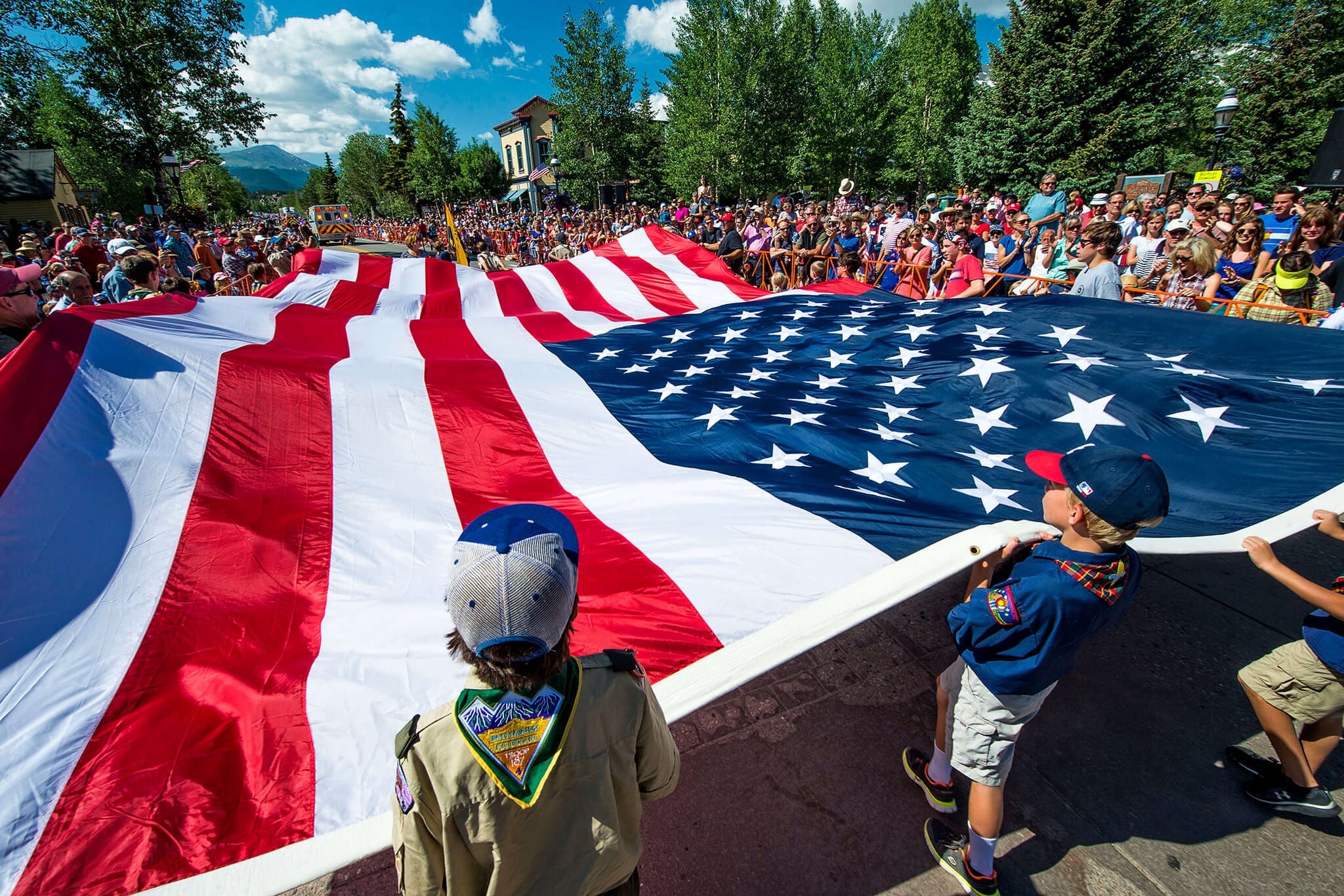 Boys Scouts holding a large flag at the Breckenridge 4th of July Parade