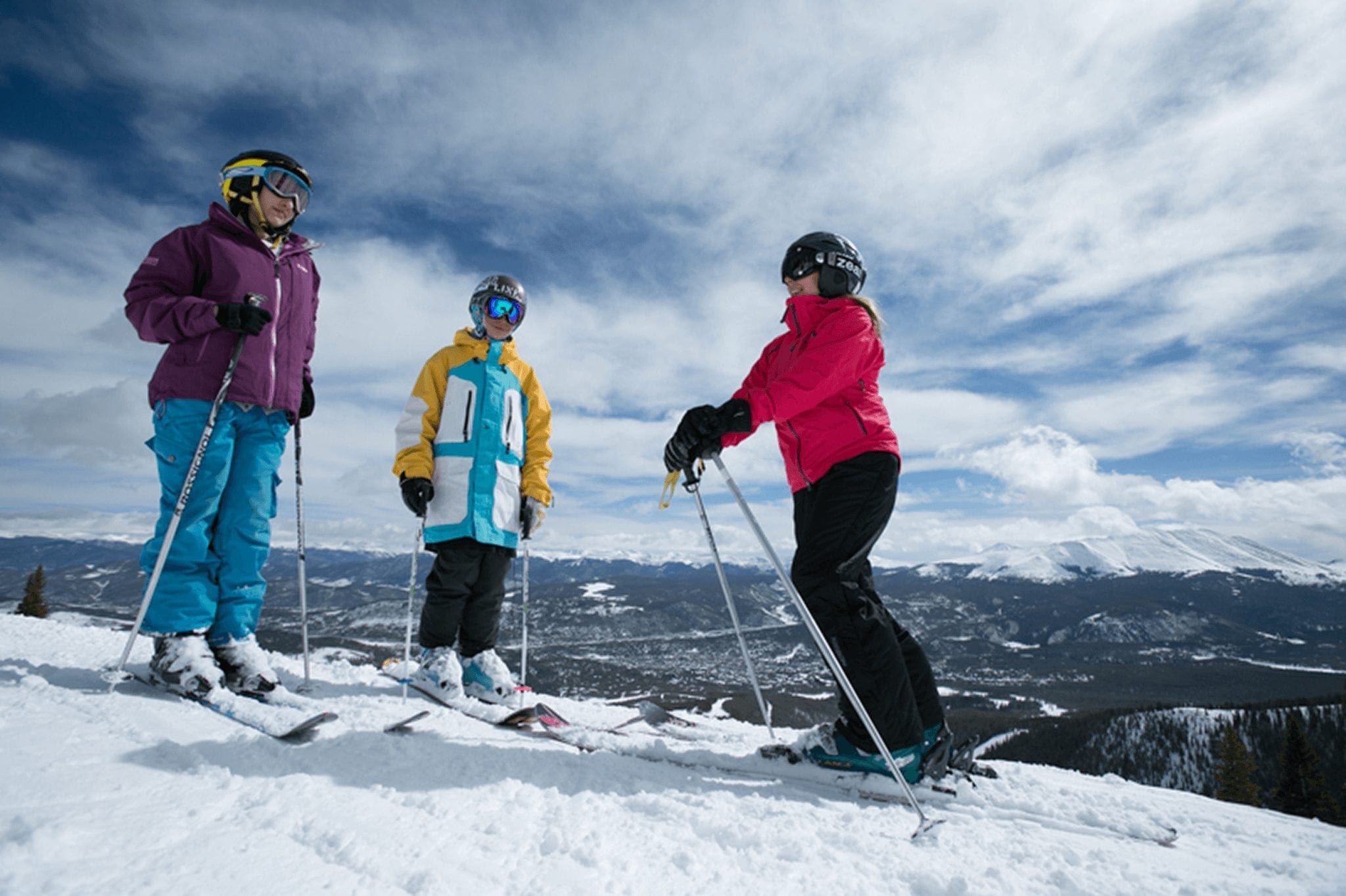 Group of skiers stopped at the top of a Breckenridge ski run
