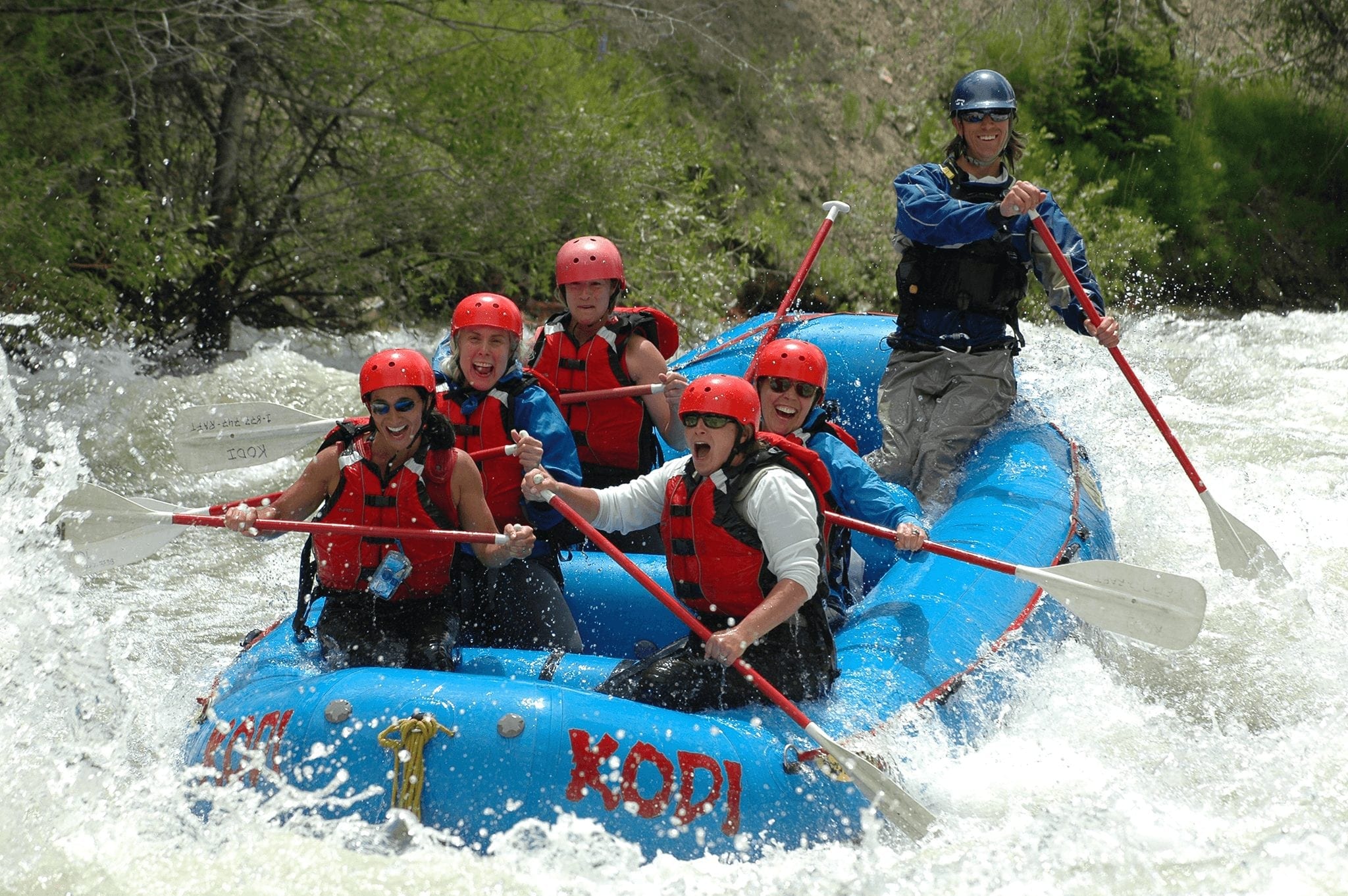 A group river rafting during a Breckenridge summer