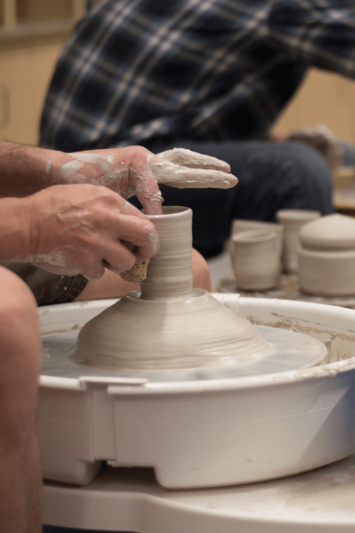 Breckenridge Creative Arts people making ceramic cups at one of the Breckenridge workshops.