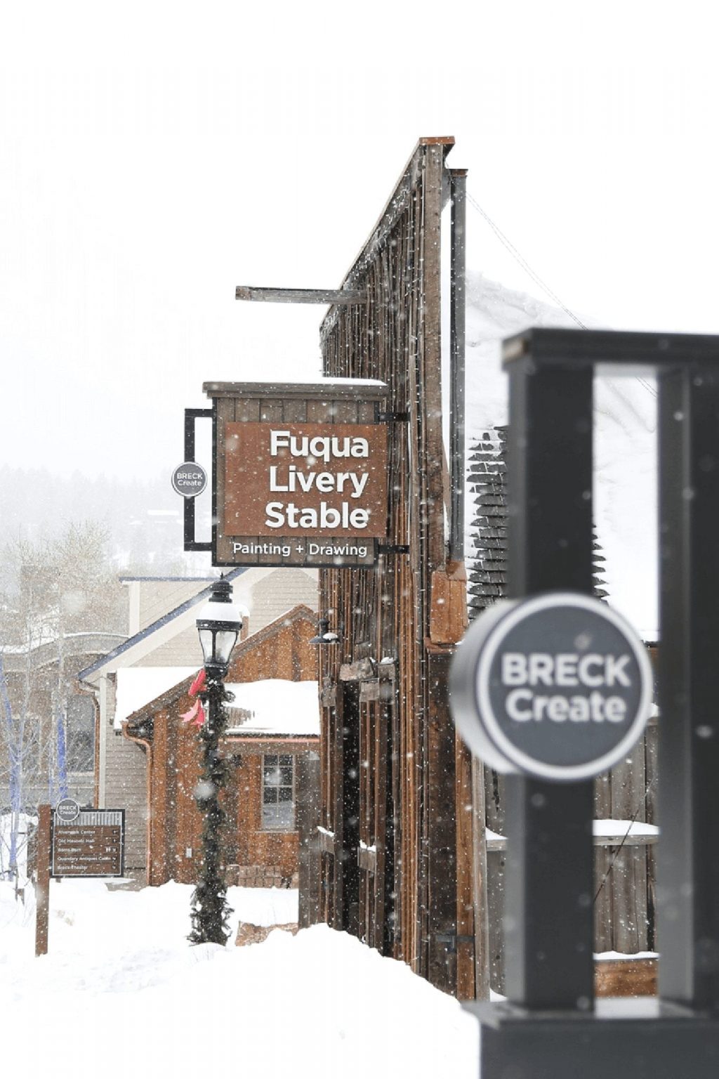 A Breckenridge downtown shop, Fuqua Livery Stable, during a winter snow.