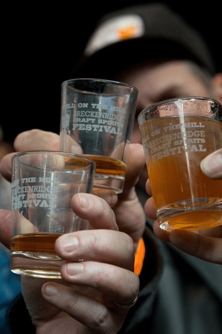 Cheers with spirits in Breckenridge Craft Spirits festival glasses.
