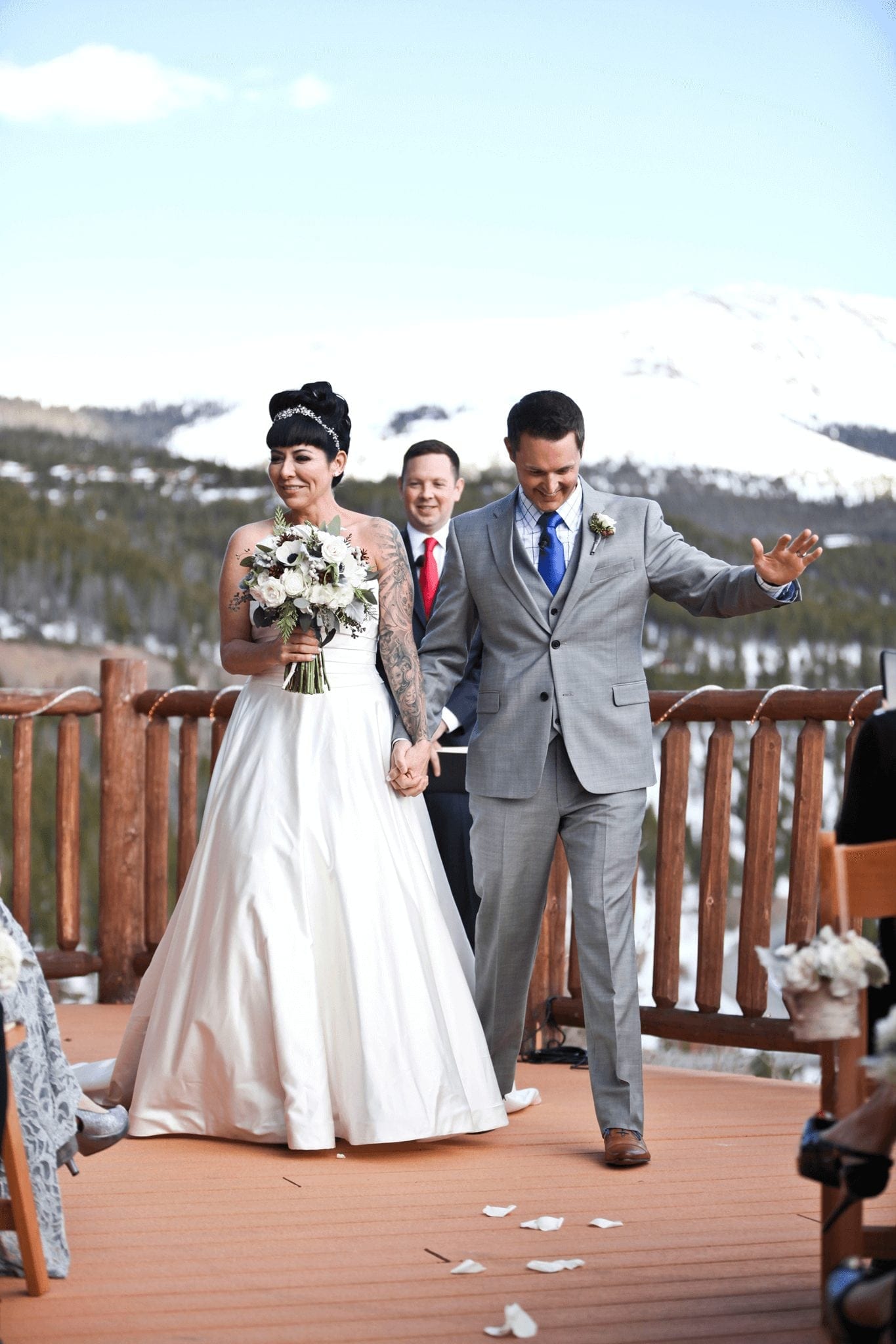 Winter Wedding in Breckenridge: couple leaving ceremony