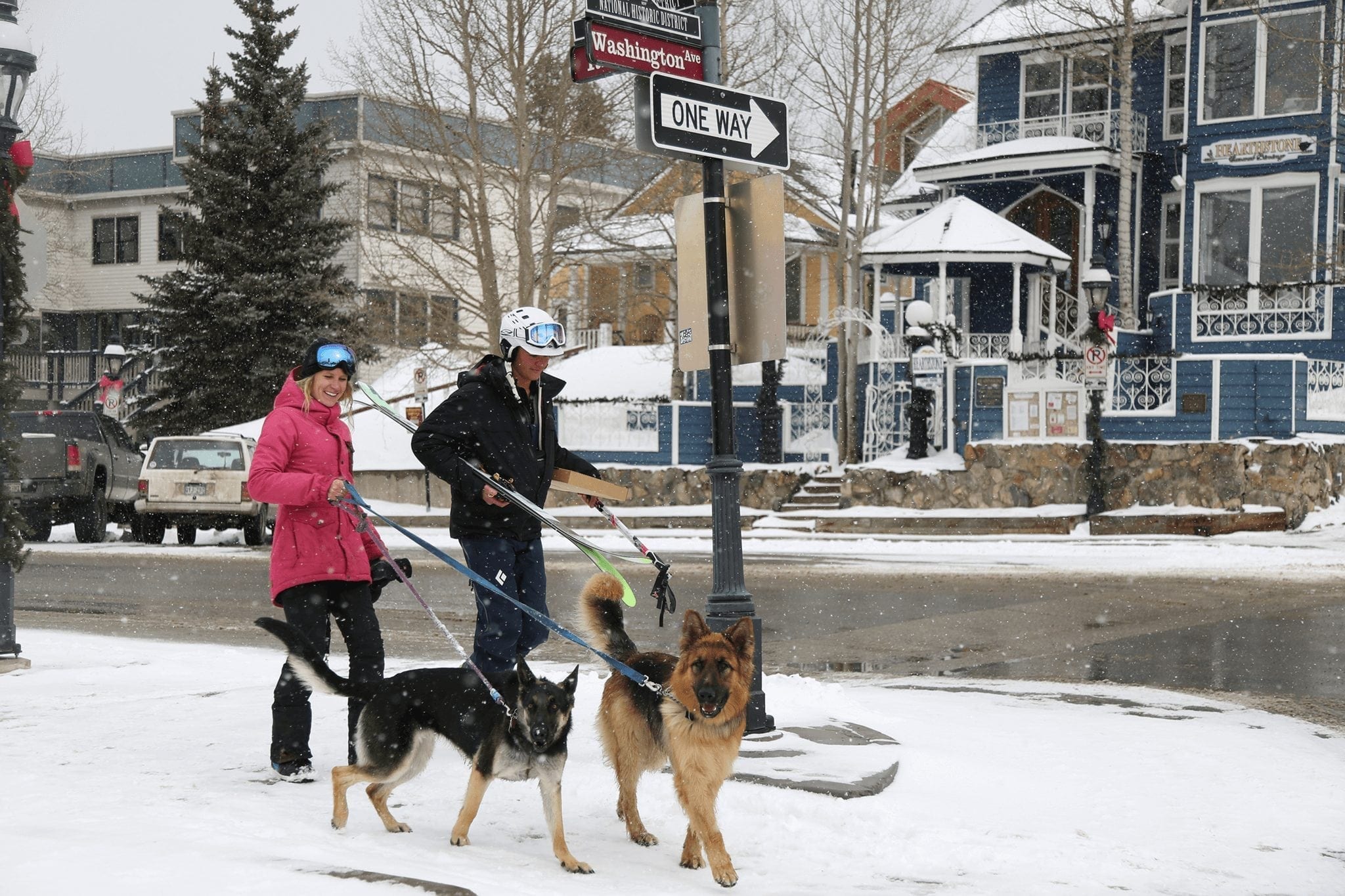 Couple Walking Dogs in Downtown Breckenridge in Winter