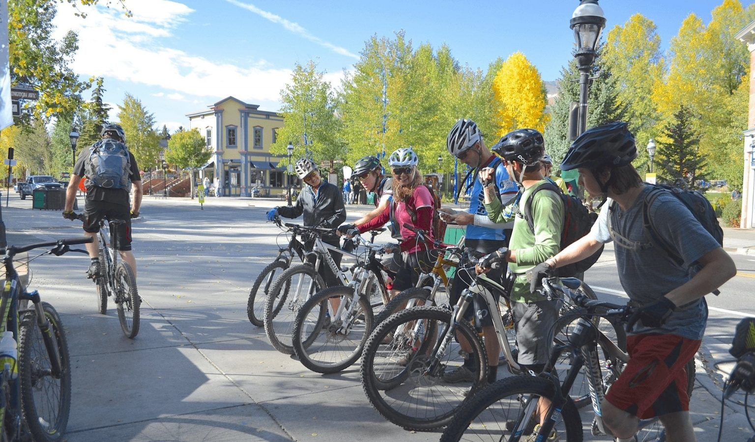 Group biking on Main Street at Camp 9600 in Breckenridge, Colorado
