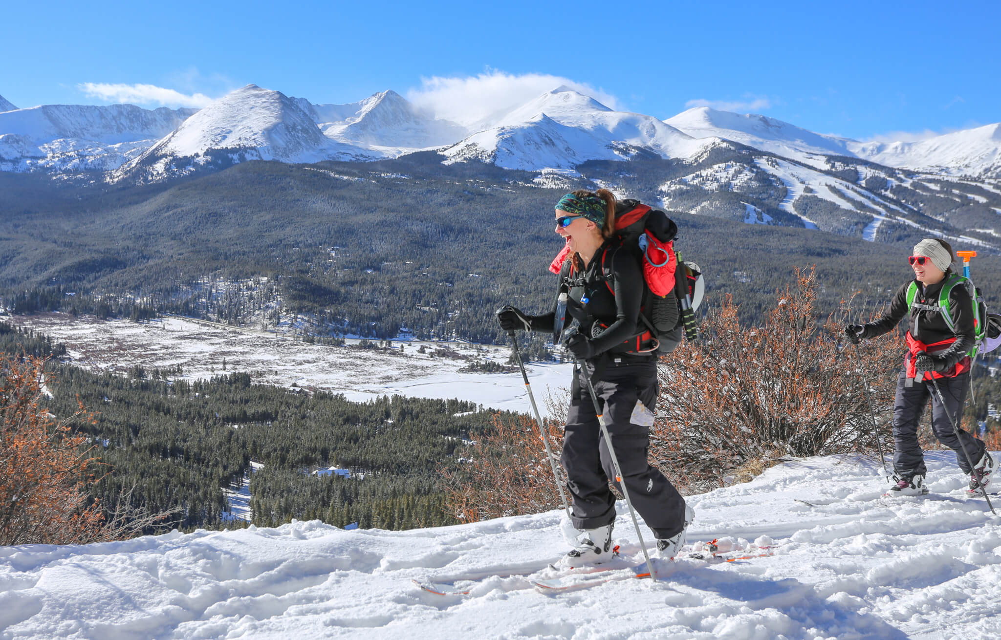 A woman hiking on Boreas Pass Road in the winter in Breckenridge.