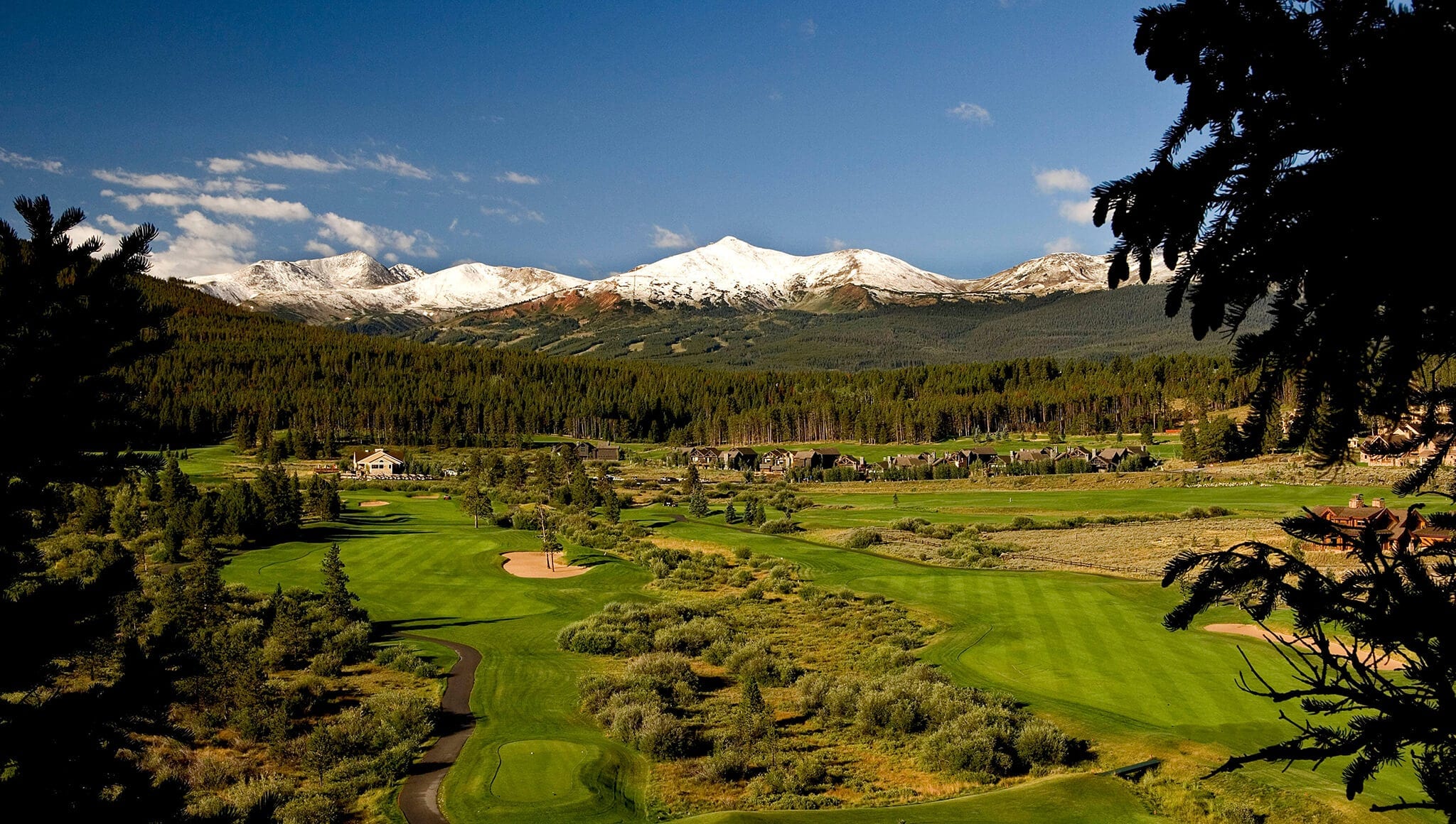 Overview of Breckenridge's Jack Nicklaus Golf Club with mountains in background.