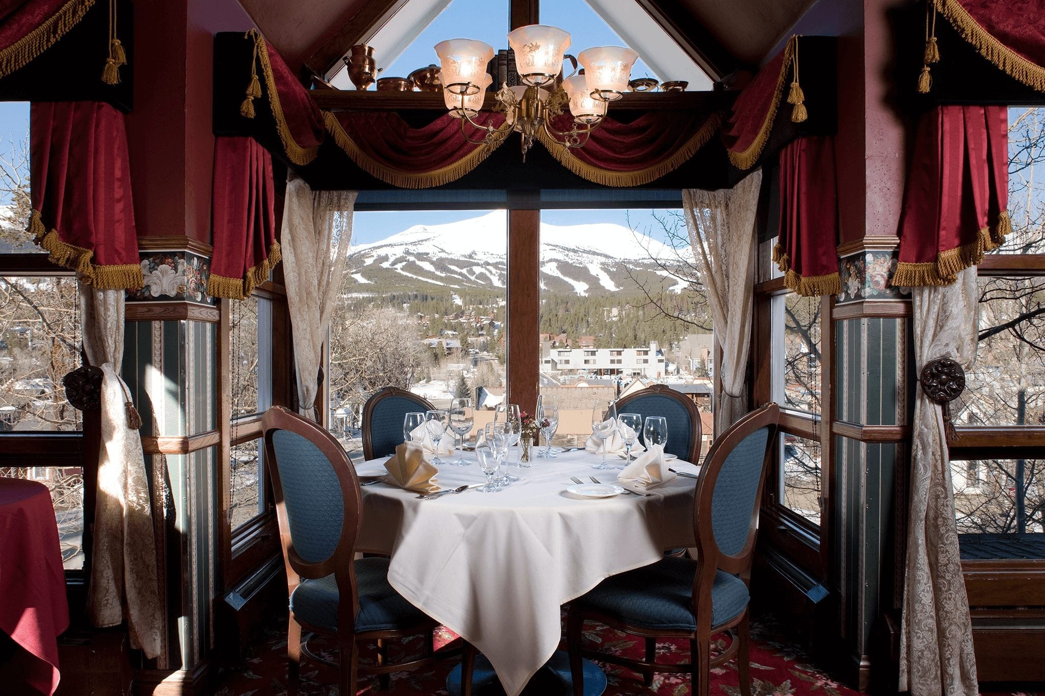 Table with a mountain view at Breckenridge's Hearthstone Restaurant