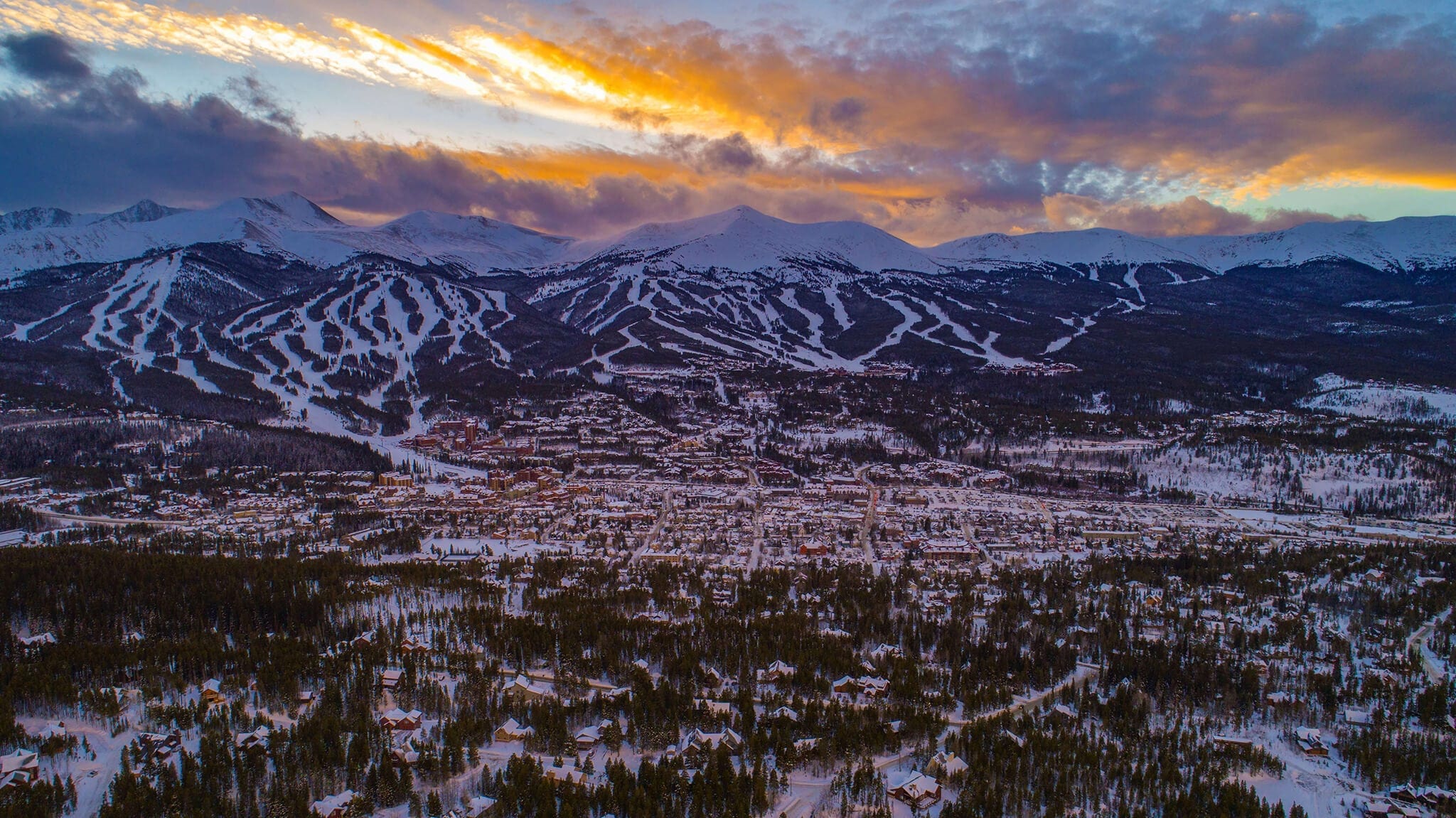 Aerial shot of a sunset over Breckenridge Ski Resort, one of the best ski resorts in Colorado.
