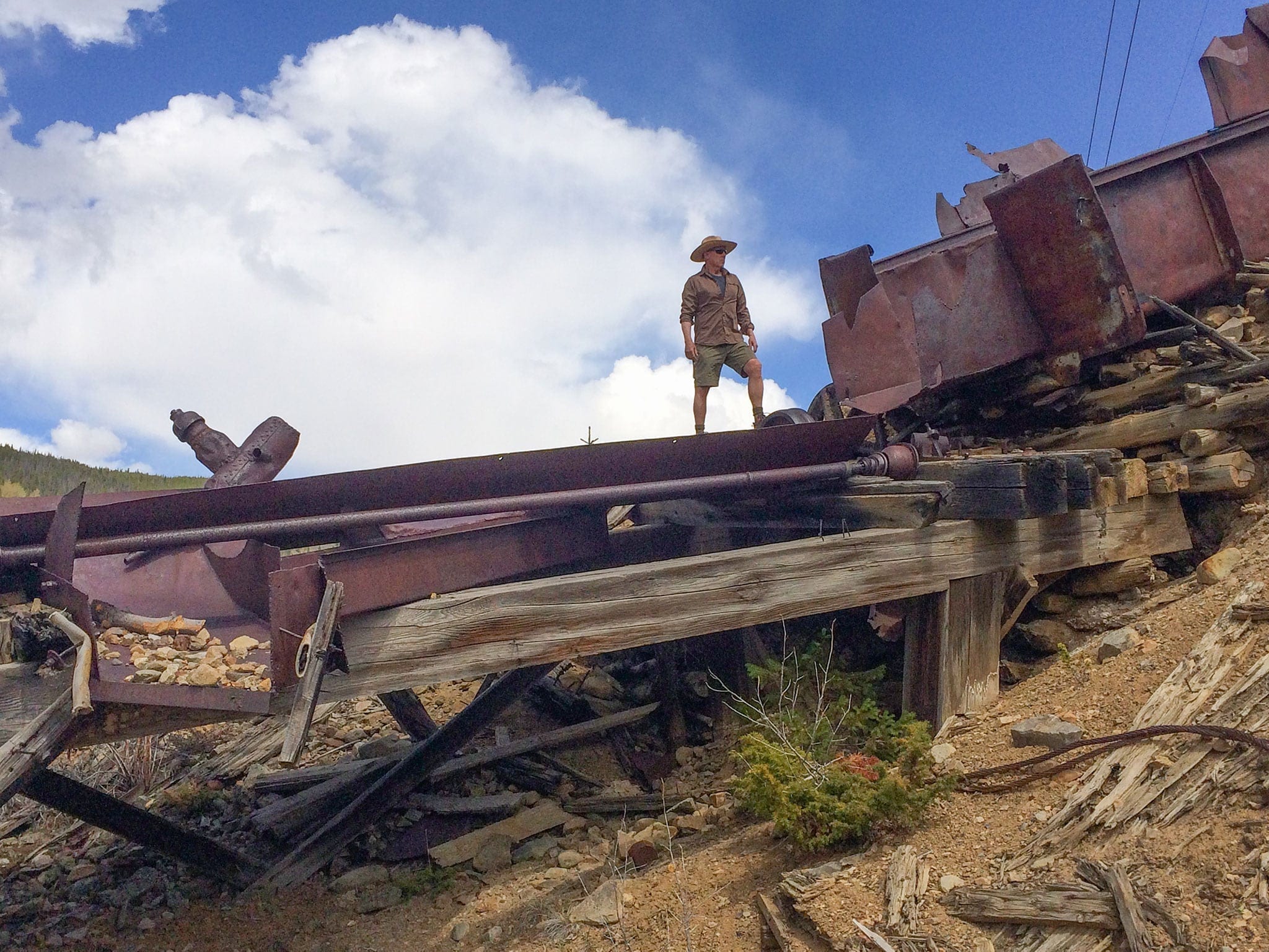 A hiker on mining remnants near Country Boy Mine.