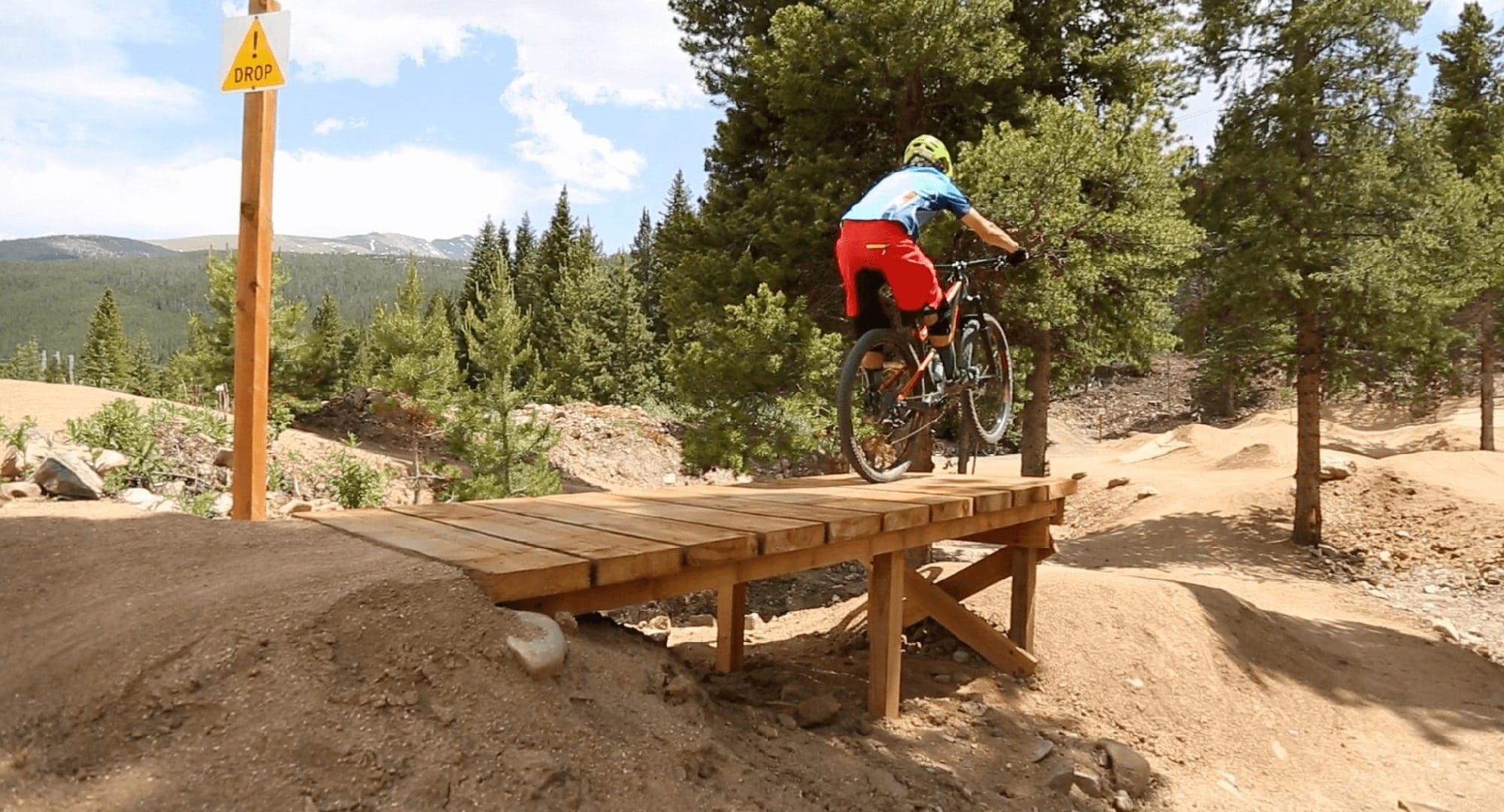 Teen on table top feature at Breckenridge Bike Park