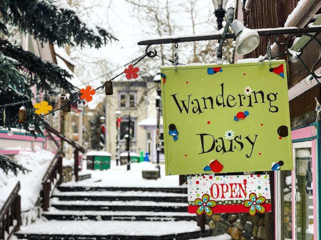 Wandering Daisy shop sign outside of its store in Breckenridge