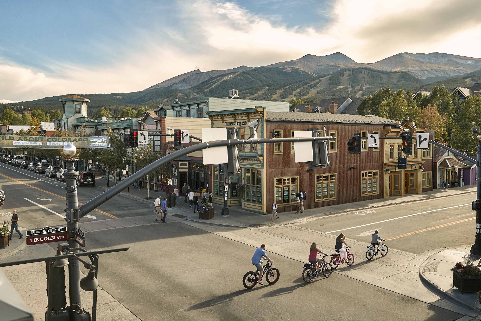 People cycling through downtown Breckenridge on Main Street