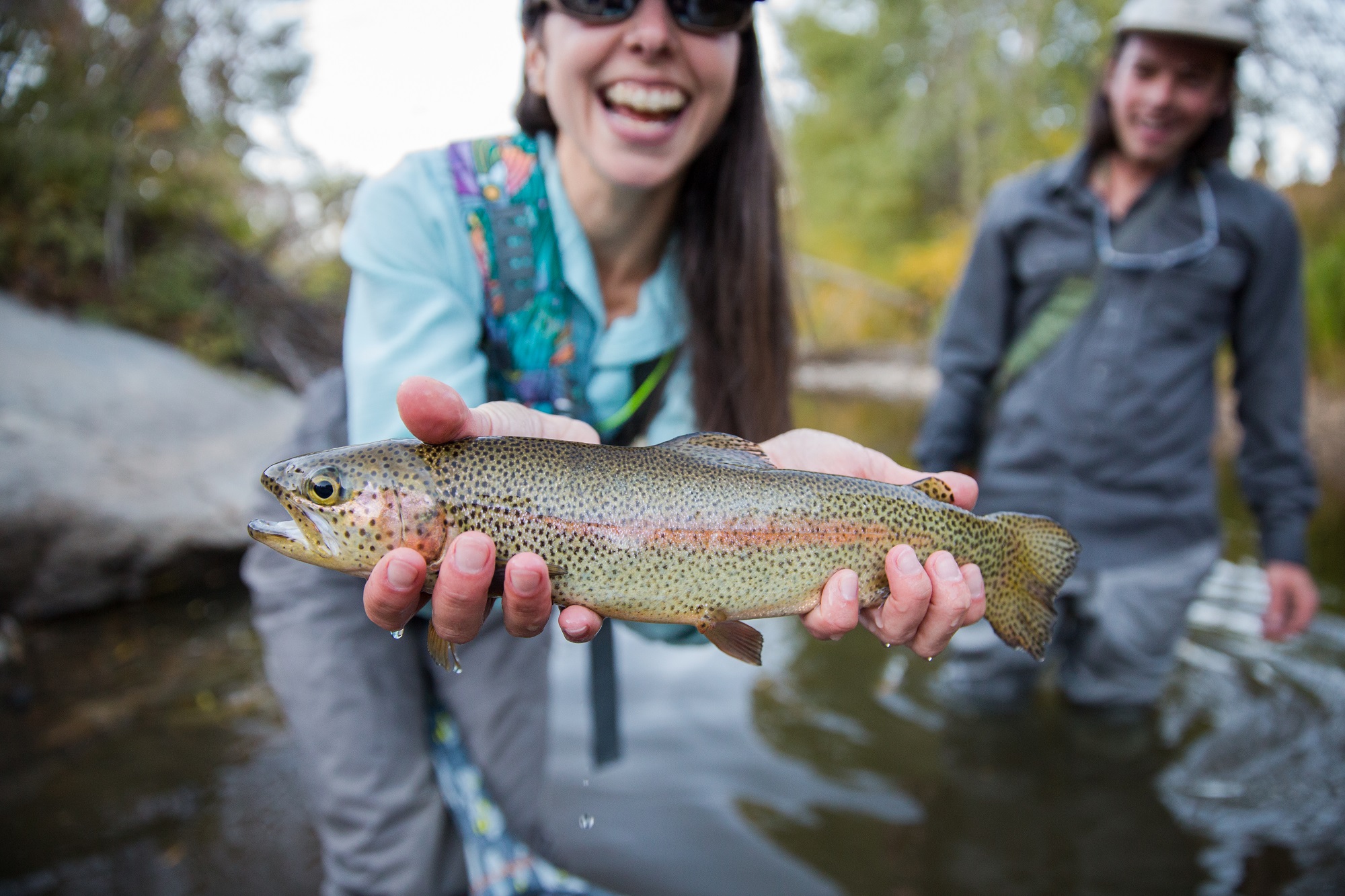 Woman holding a rainbow trout