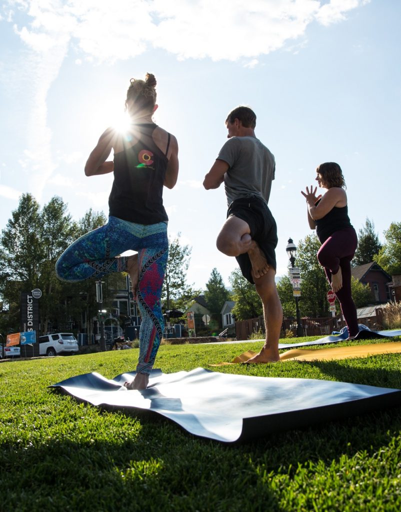 People doing Outdoor Yoga at Breckenridge