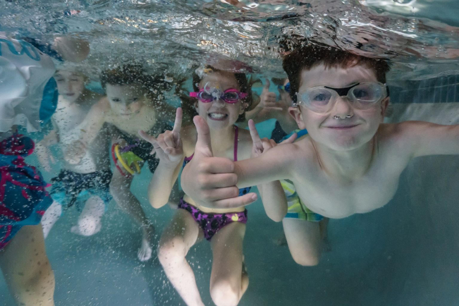 Kids underwater at the pool