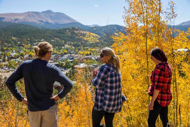 A group of hikers in flannel looking over Breck