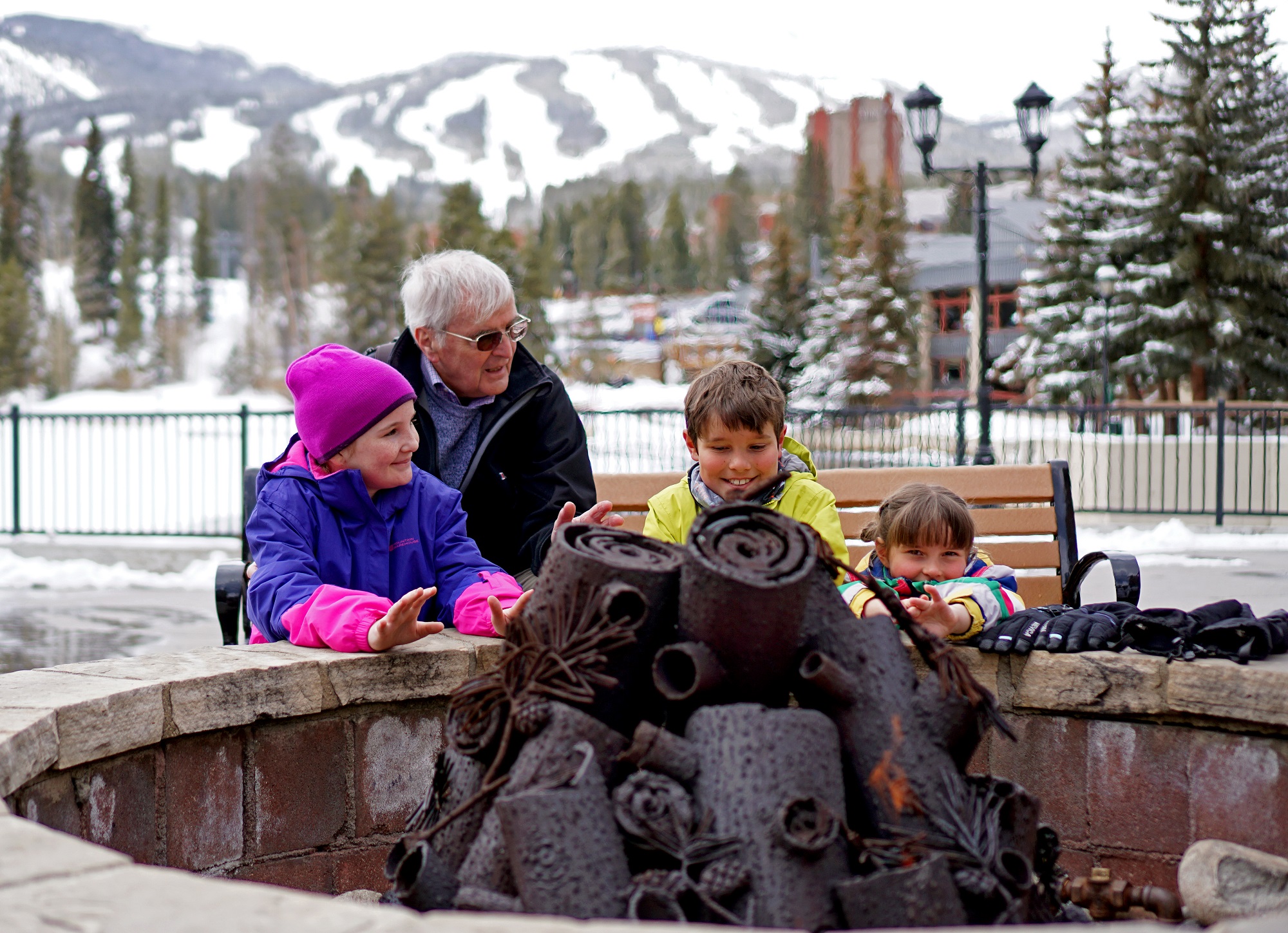 Maggie Pond in winter with family around fireplace