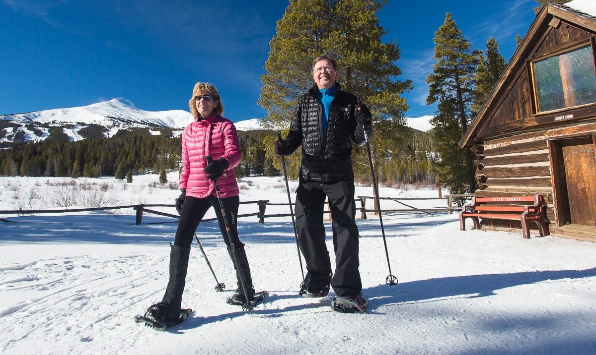 An older couple snowshoeing at the Breckenridge Nordic Center 