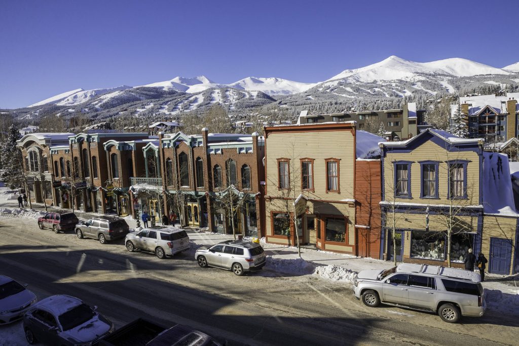 storefront view in front of mountains