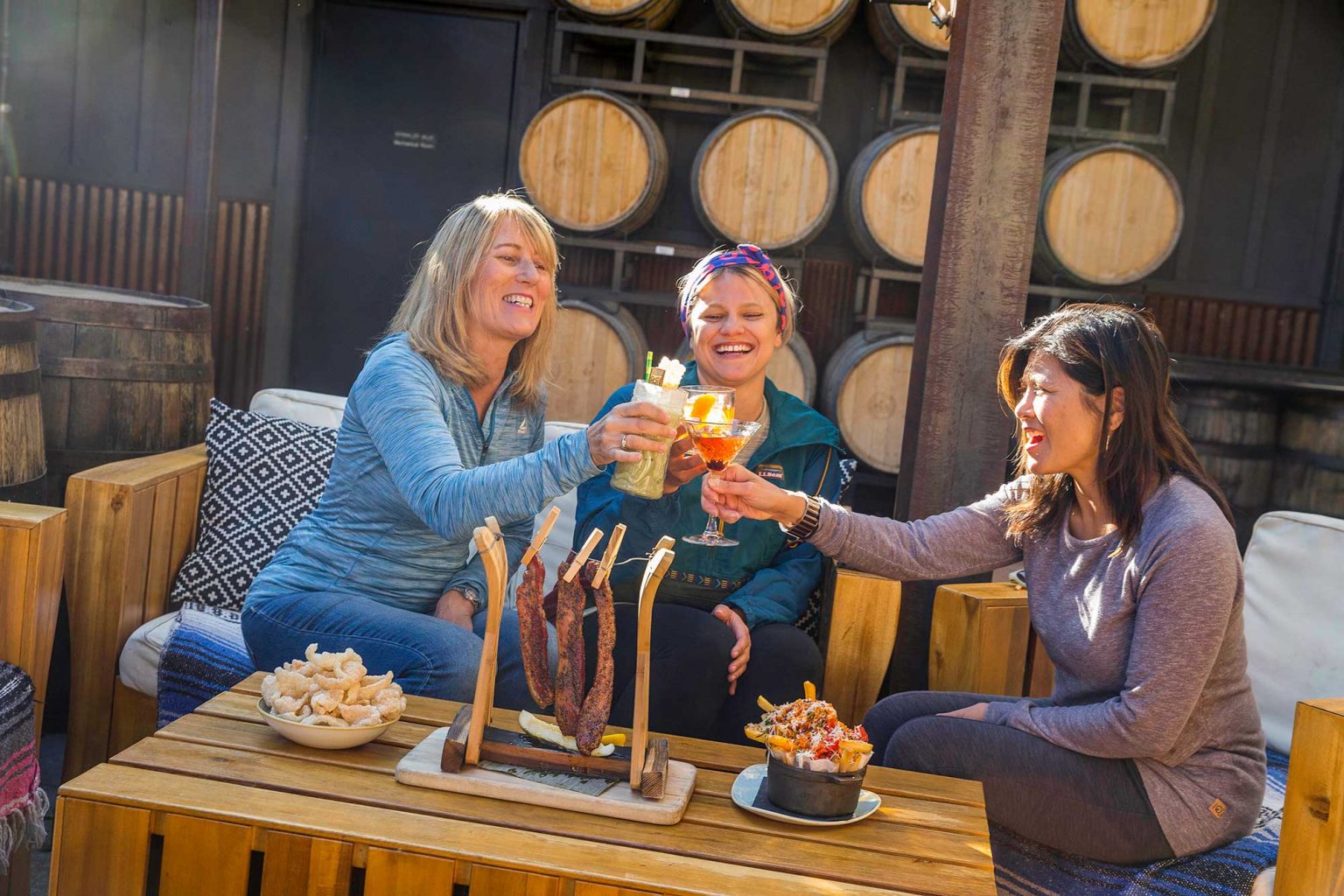 women cheers at Breckenridge Distillery patio