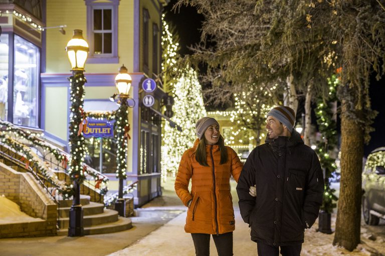 Couple walking during Breck in the Spirit 2018 holiday lights