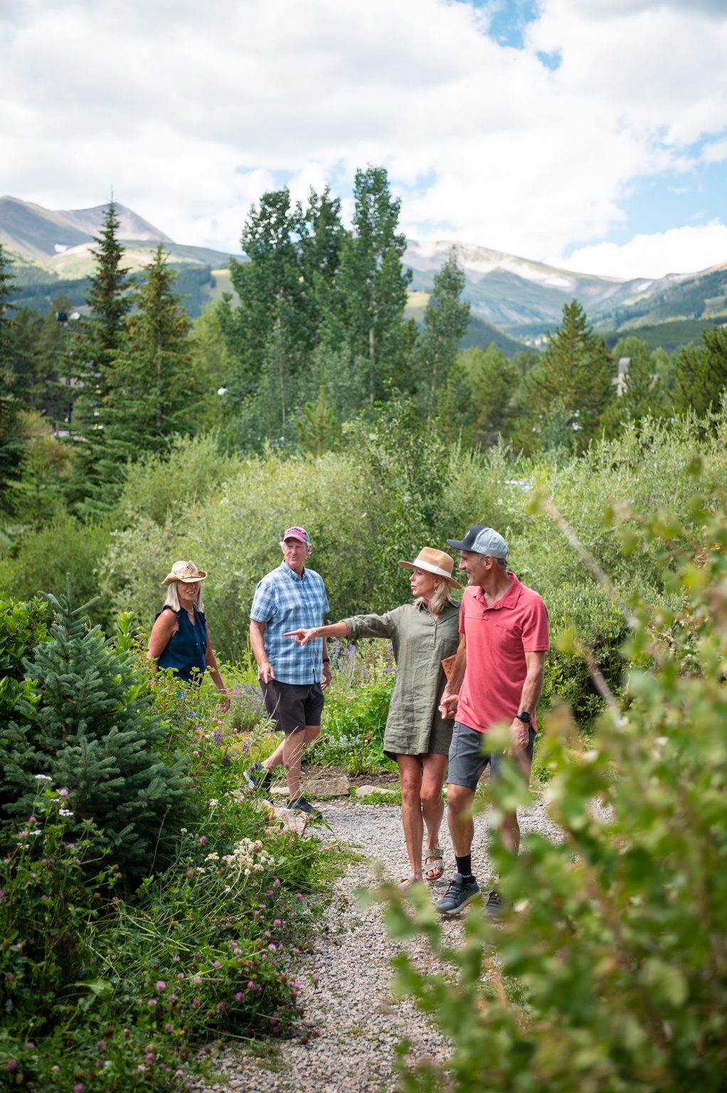 two older couples enjoying nature on a hike