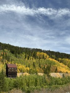 Fall colors and an historic preserved mining building called Minnie Mine. 