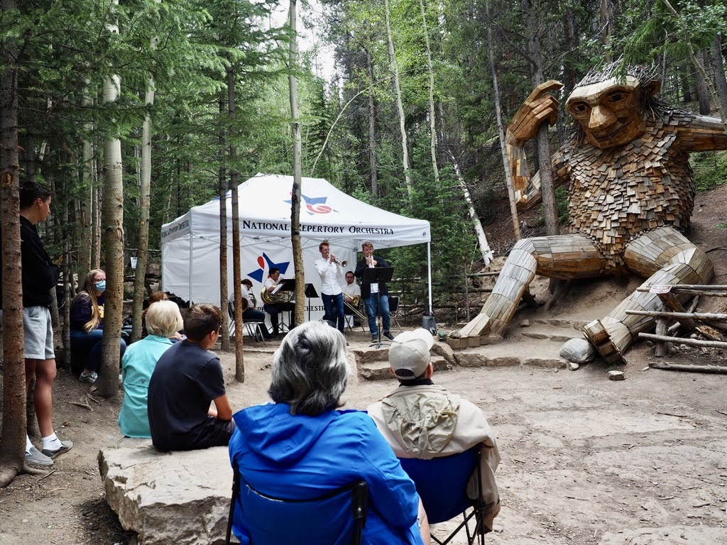 An outdoor concert in the forest of Breckenridge.